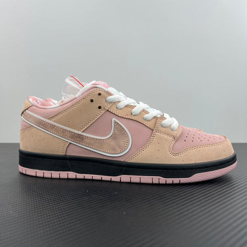 Pink and tan low-top sneaker with white laces, swoosh logo, and black sole
