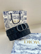 Dior belt, folded view, dark logo fabric strap with round D buckle