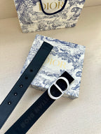 Navy belt with metal pin holes and silver-tone D buckle