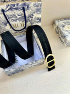 Navy fabric belt with gold-tone D buckle and matching loop-through keeper