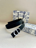 Navy fabric belt with silver-tone D buckle and loop-through keeper