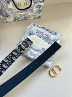 Navy leather belt with silver buckle and evenly spaced eyelets