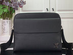 Louis Vuitton textured leather crossbody bag with flap, LV logo, and black shoulder strap
