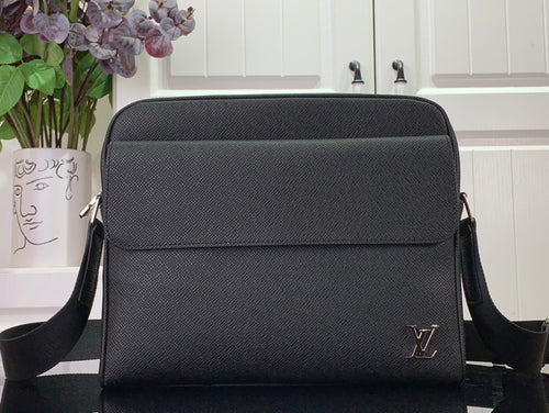 Louis Vuitton textured leather crossbody bag with flap, LV logo, and black shoulder strap