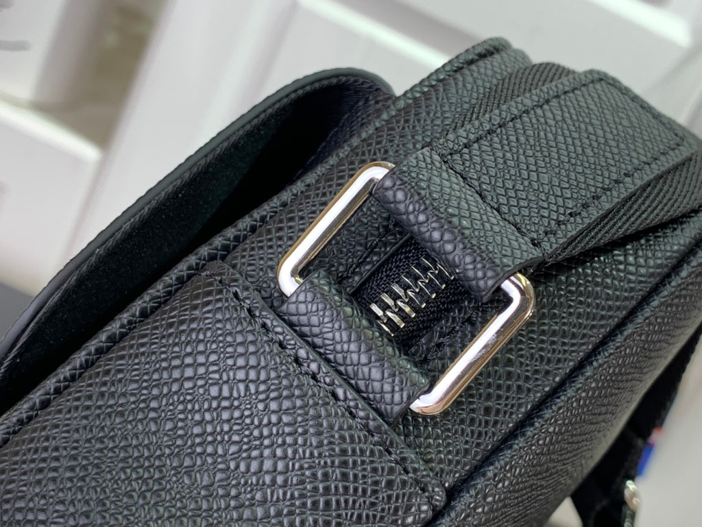 Louis Vuitton crossbody strap attachment with metal buckle and textured leather