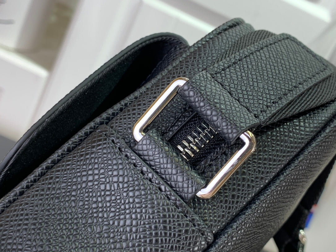 Louis Vuitton crossbody strap attachment with metal buckle and textured leather