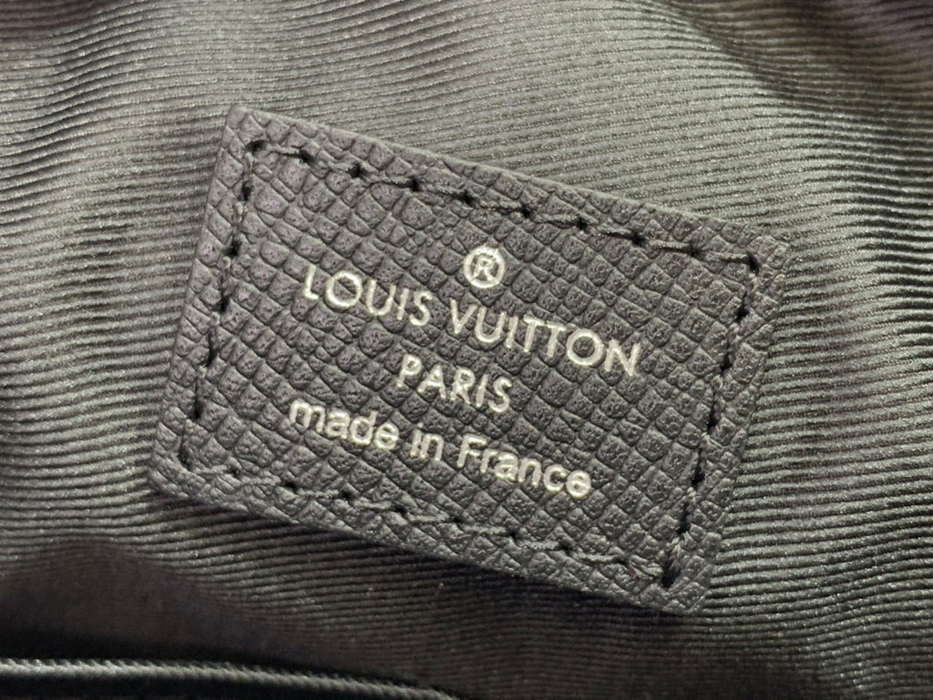 Louis Vuitton Paris made in France leather label on textured black bag