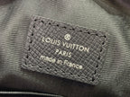 Louis Vuitton Paris made in France leather label on textured black bag
