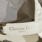 White bag strap label: Christian Dior Paris
