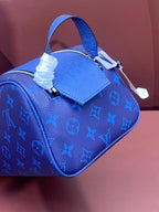 Blue monogram leather top-handle bag with metal clasp