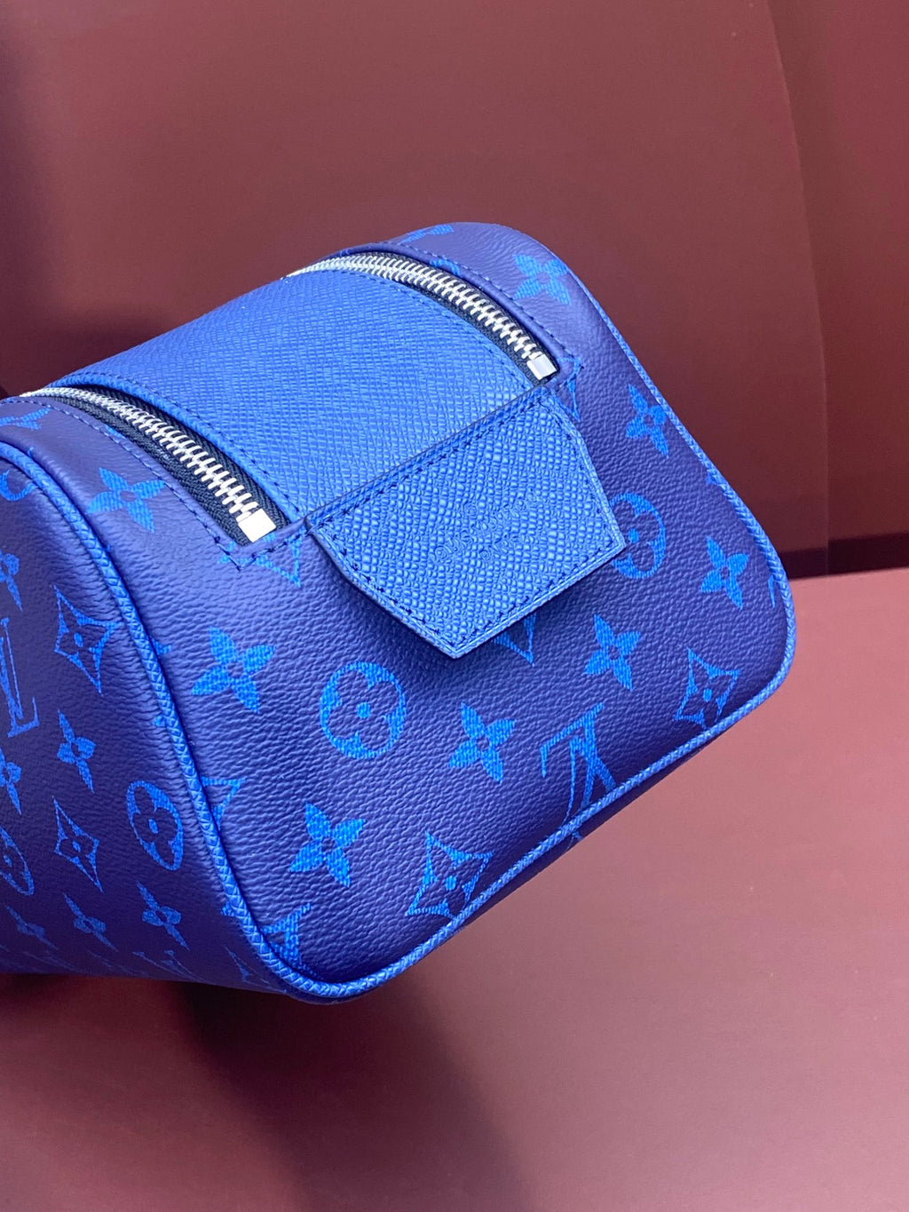 Blue monogram zip bag with structured front flap