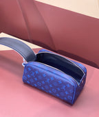 Blue monogram zip vanity bag, open top with dark interior