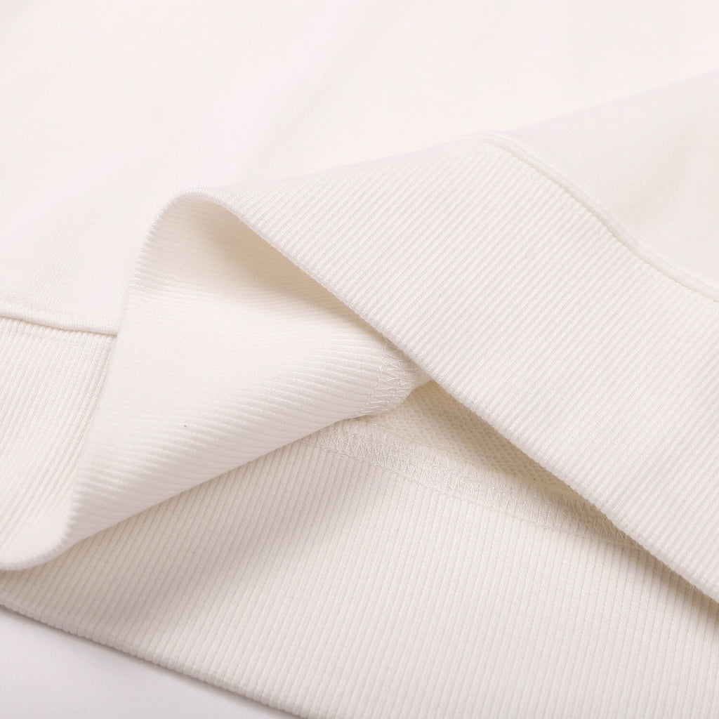 White sweatshirt fabric detail with ribbed hem