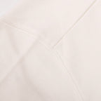 White sweatshirt side seam with stitched panel