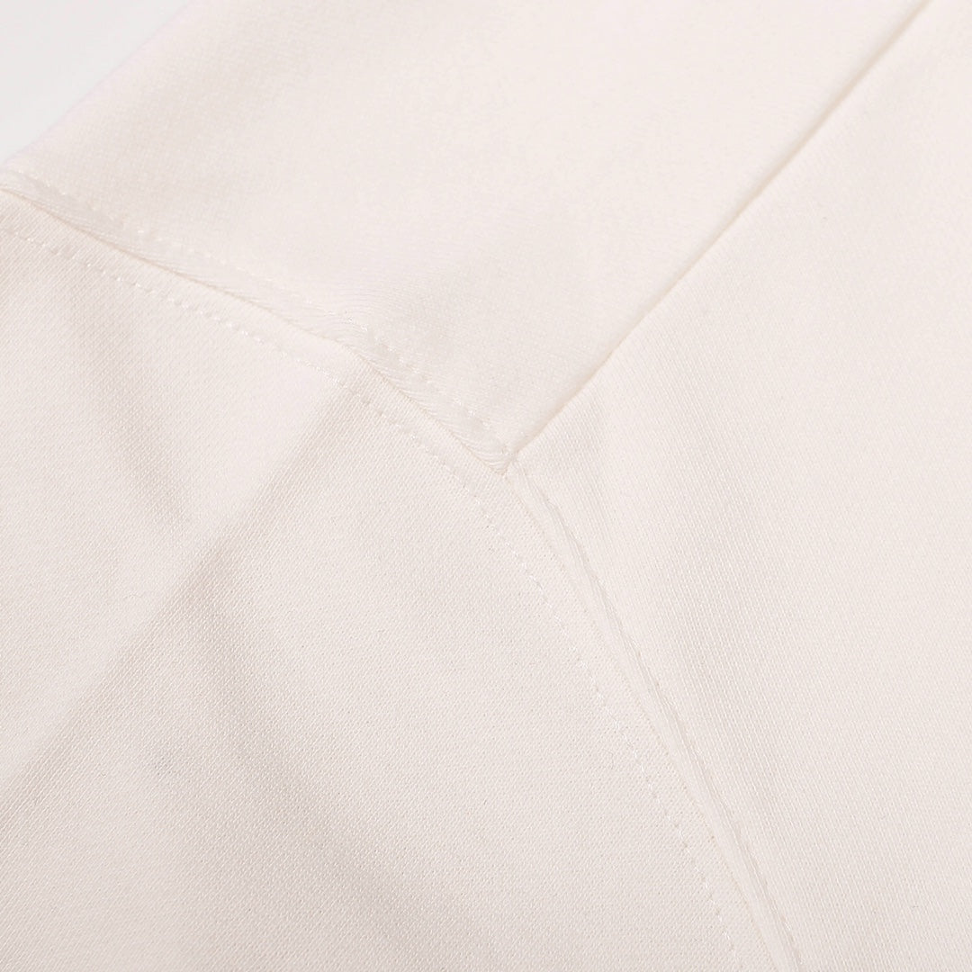 White sweatshirt side seam with stitched panel