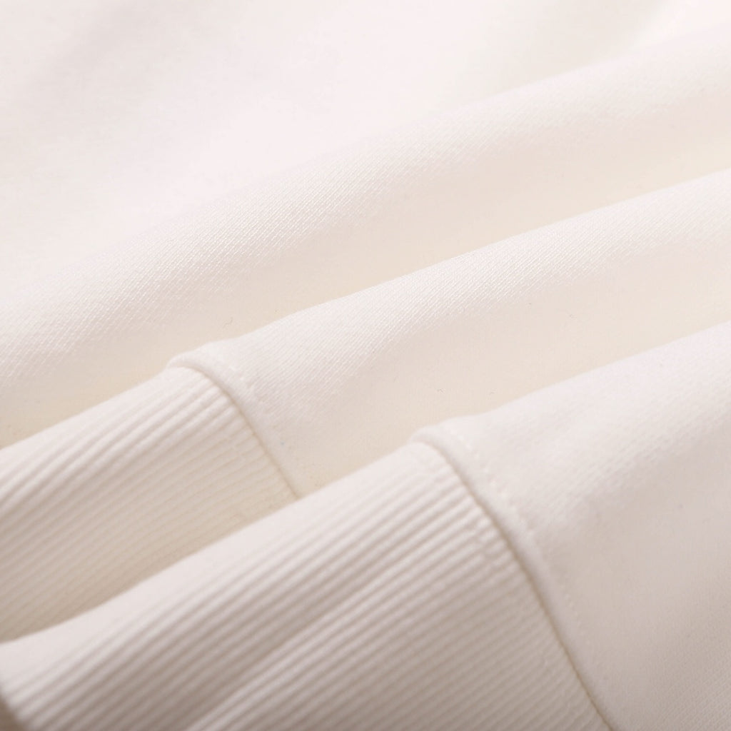 White sweatshirt sleeve seam with ribbed cuff edge