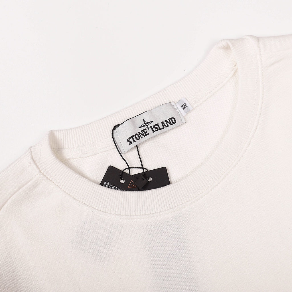 White crewneck sweatshirt neckline with brand label tag