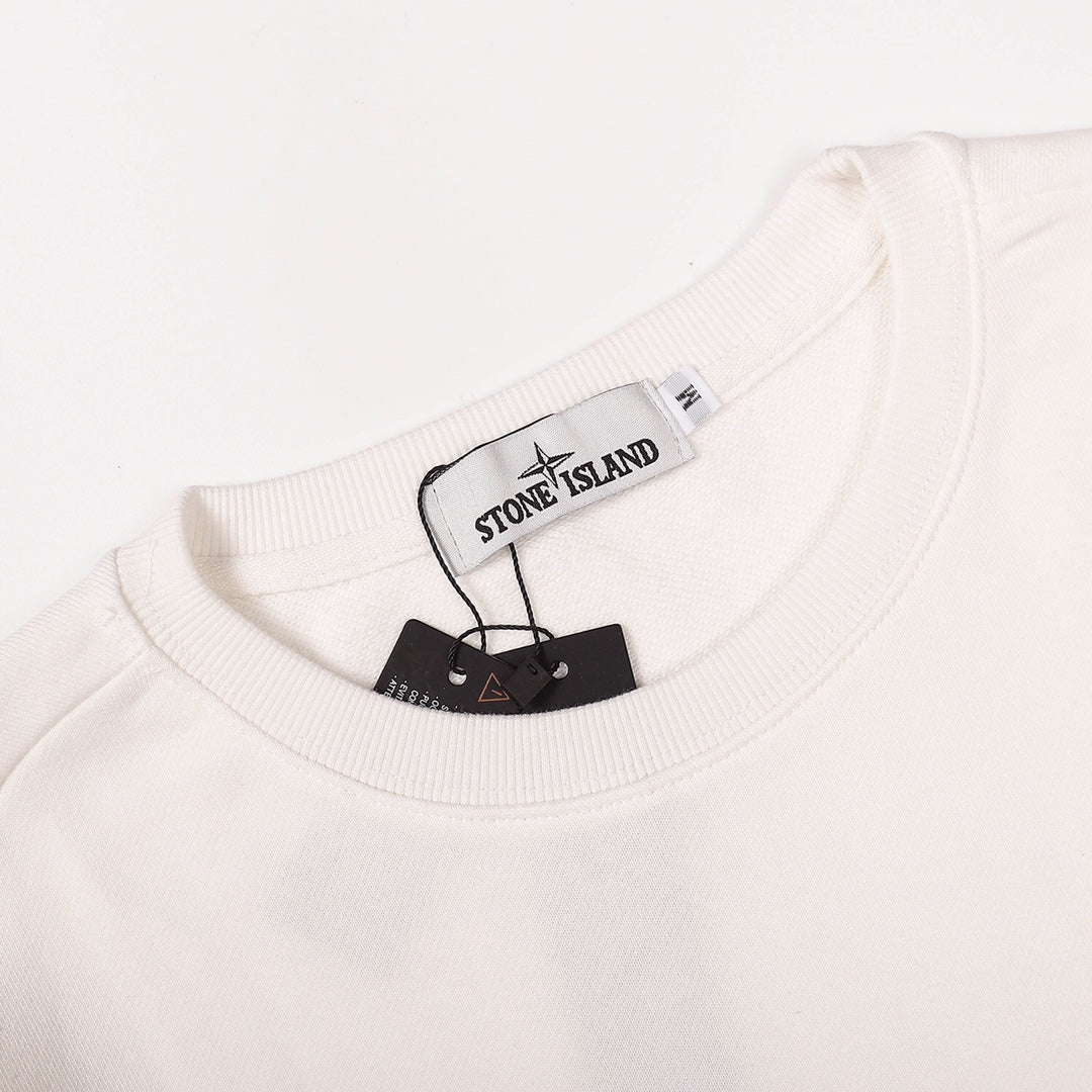 White crewneck sweatshirt neckline with brand label tag