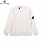 White crewneck sweatshirt with Stone Island logo patch at sleeve