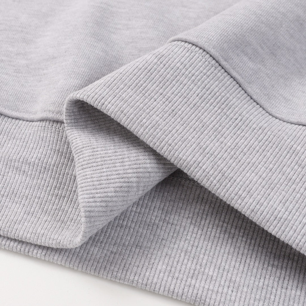 Grey sweatshirt ribbed cuff and sleeve seam detail