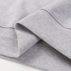 Grey sweatshirt ribbed cuff and sleeve seam detail