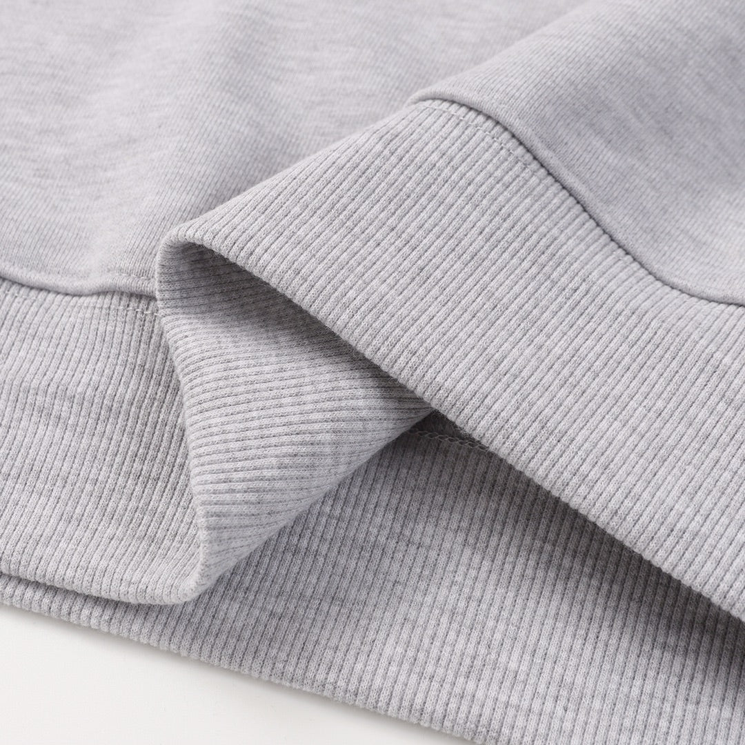 Grey sweatshirt ribbed cuff and sleeve seam detail