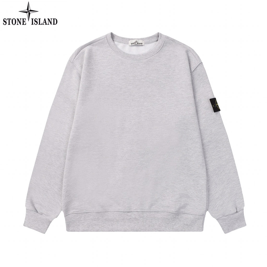 Grey crewneck sweatshirt with long sleeves and Stone Island sleeve patch