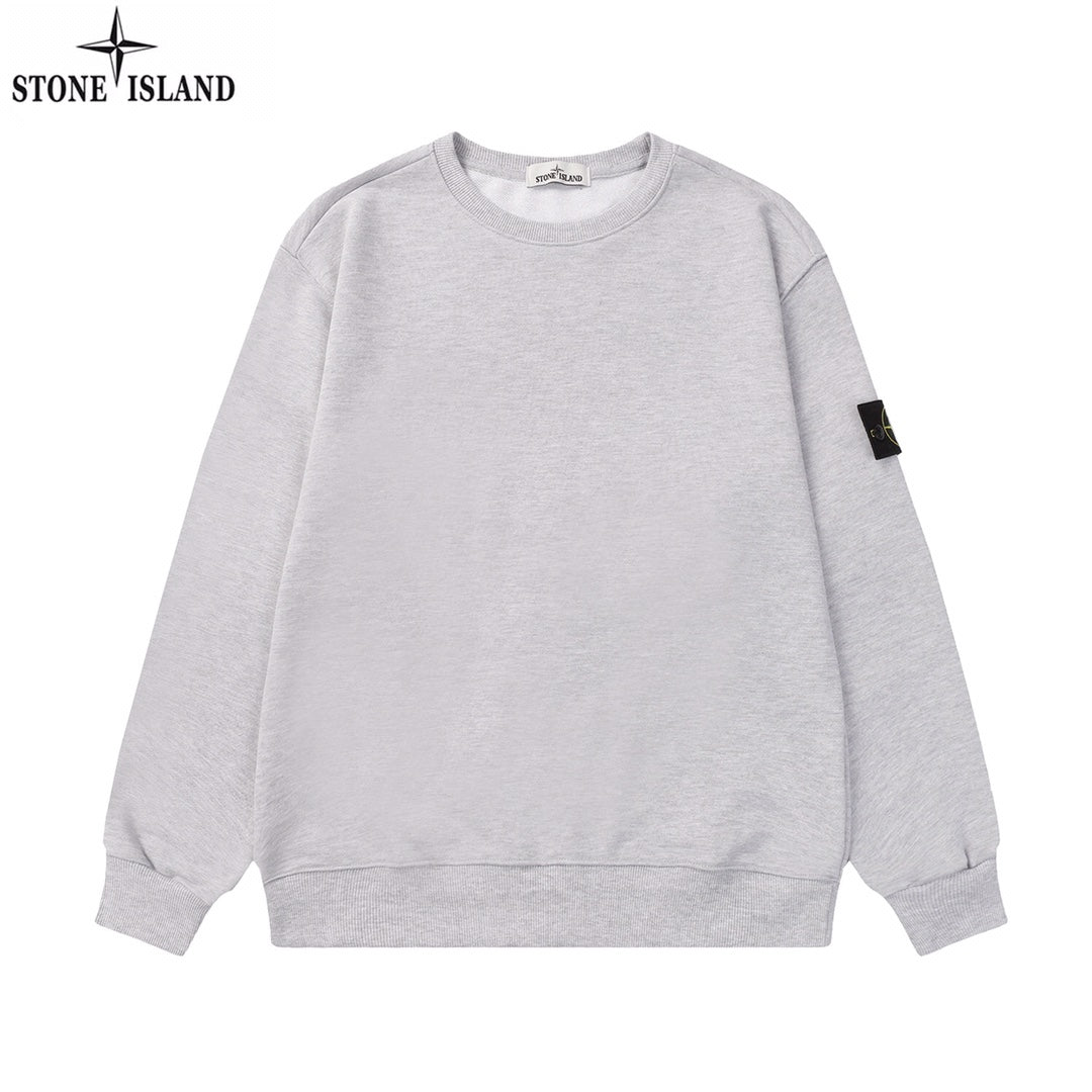 Grey crewneck sweatshirt with long sleeves and Stone Island sleeve patch