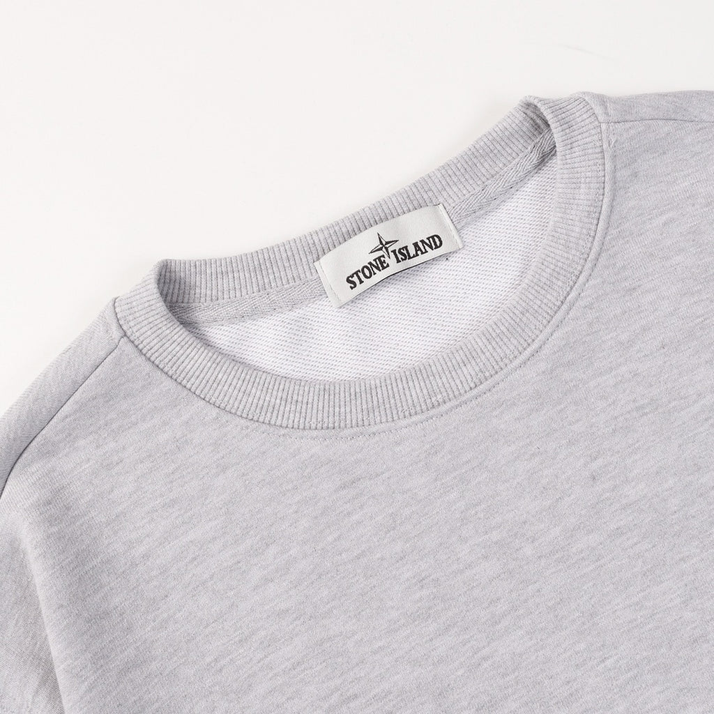 Grey crewneck sweatshirt with ribbed neckline and Stone Island neck label