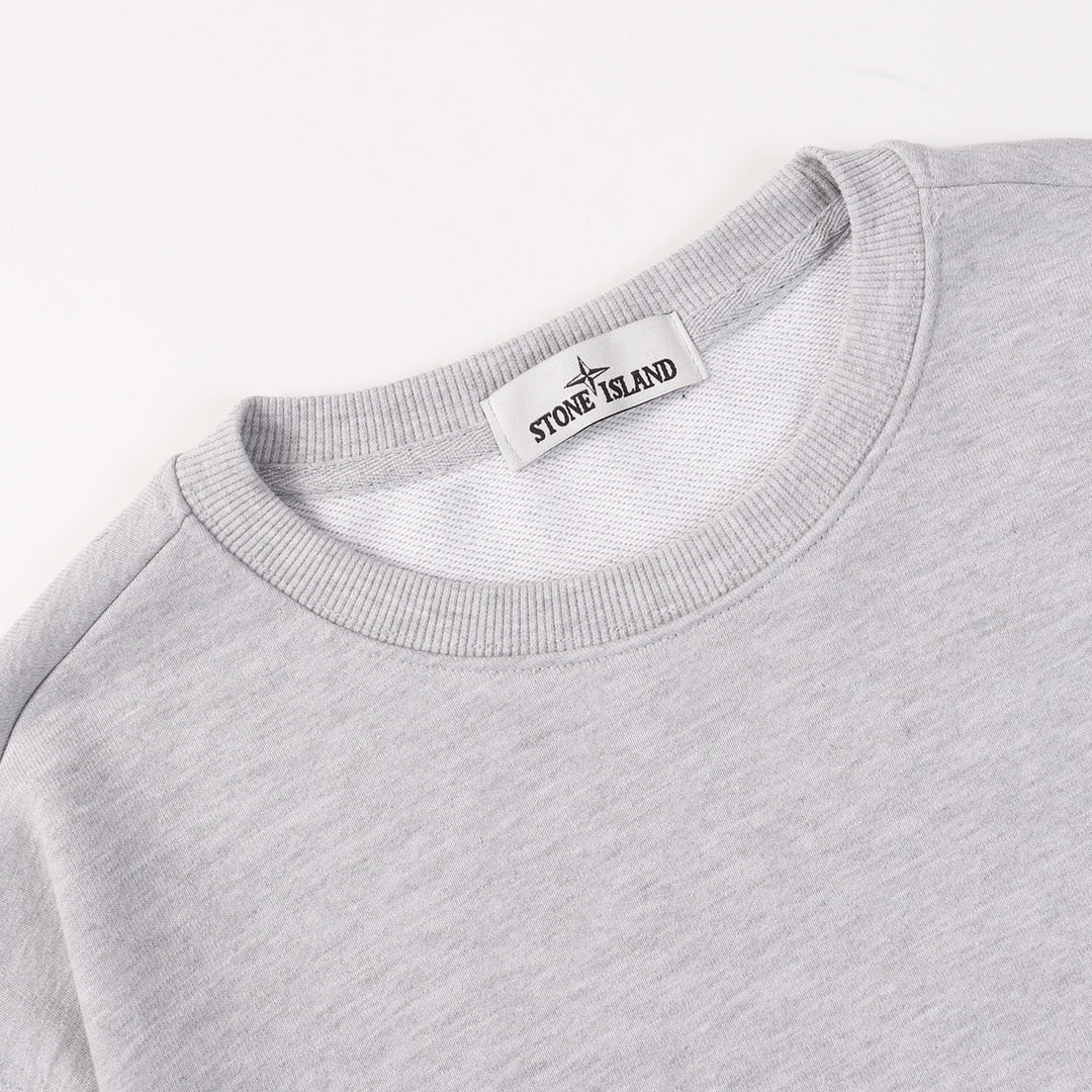 Grey crewneck sweatshirt with ribbed neckline and Stone Island neck label