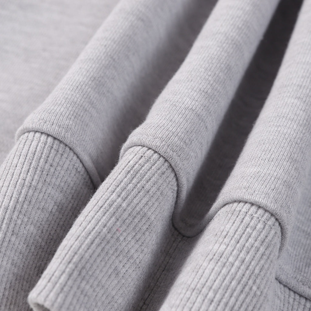 Grey sweatshirt sleeve cuffs with ribbed knit detail