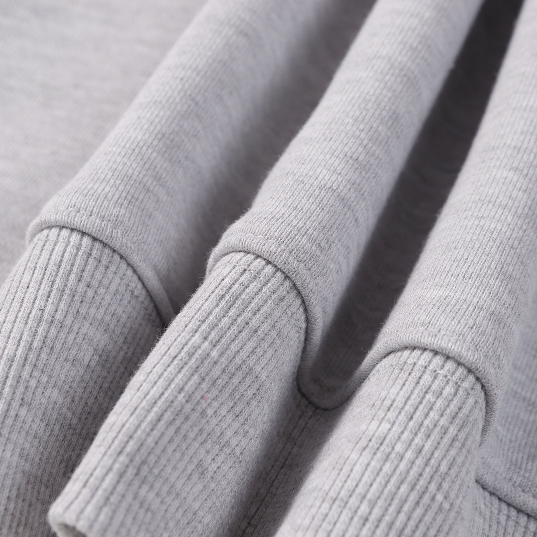 Grey sweatshirt sleeve cuffs with ribbed knit detail