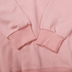Pink sweatshirt sleeve cuffs and hem with ribbed knit detailing
