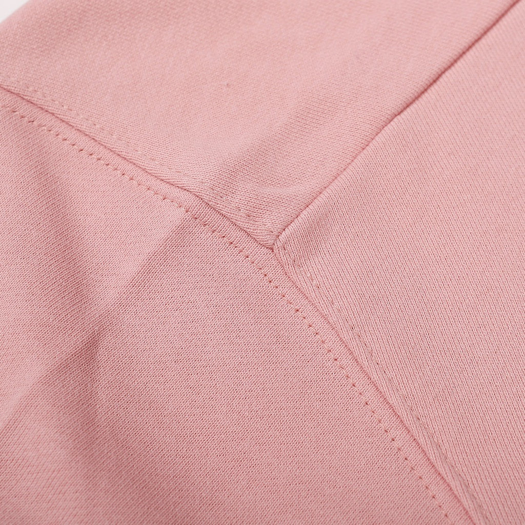 Pink sweatshirt front seam and stitched panel detail
