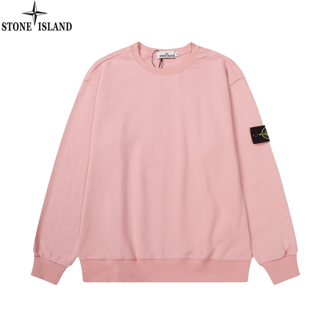 Pink crewneck sweatshirt with long sleeves and ribbed cuffs