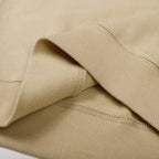 Beige crewneck sweatshirt fabric texture with ribbed cuff edge