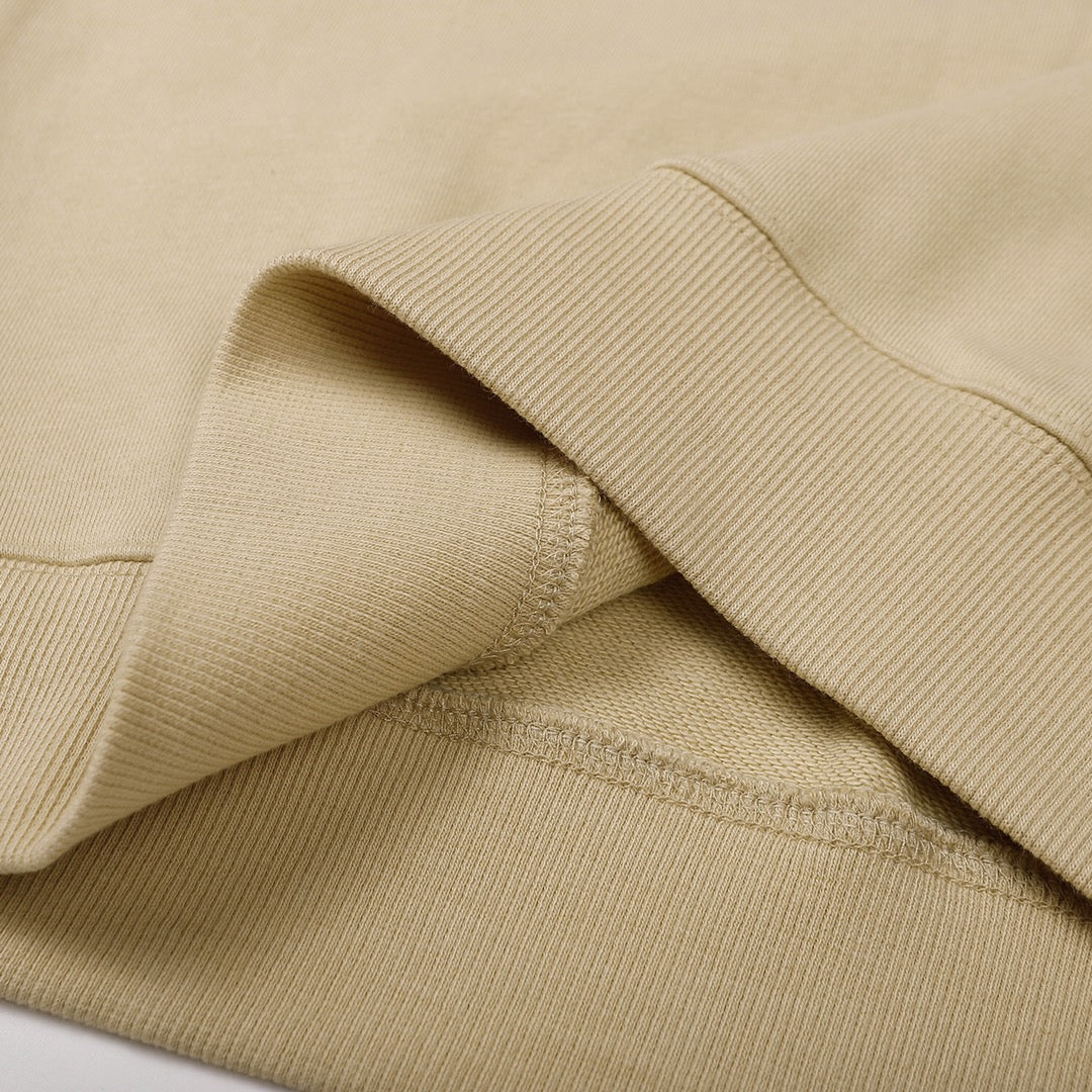 Beige crewneck sweatshirt fabric texture with ribbed cuff edge