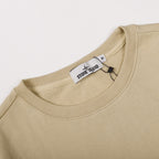Beige crewneck sweatshirt neckline with ribbed collar and inner tag