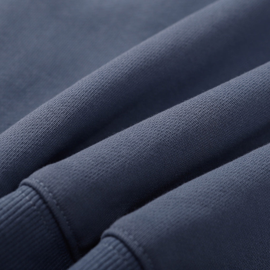 Stone Island crewneck sweatshirt, slate blue, close-up of knit fabric and sleeve cuff