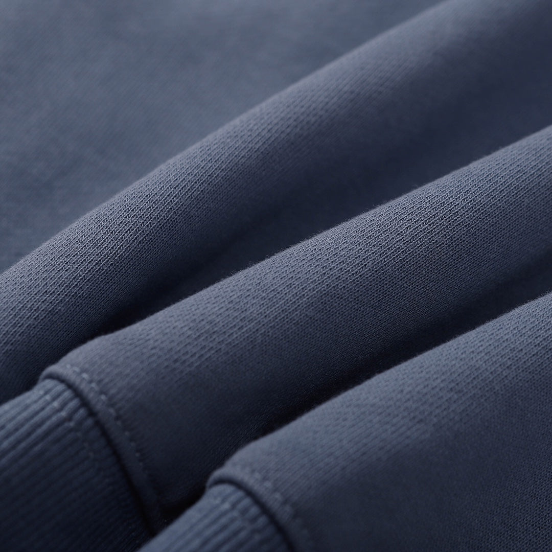 Stone Island crewneck sweatshirt, slate blue, close-up of knit fabric and sleeve cuff