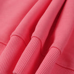 Stone Island pink sweatshirt fabric and ribbed cuffs close-up showing knit texture