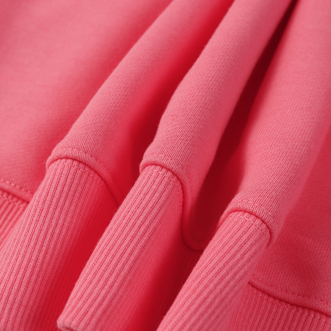 Stone Island pink sweatshirt fabric and ribbed cuffs close-up showing knit texture