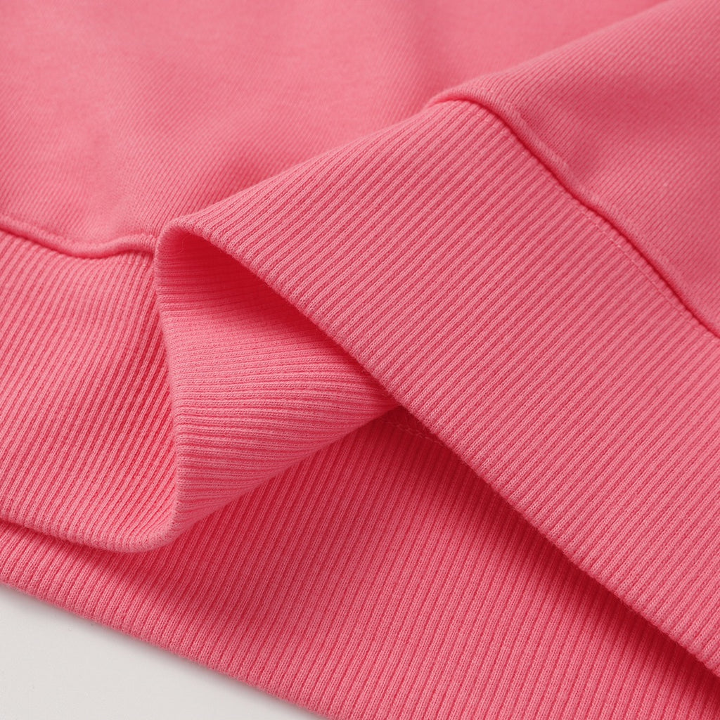 Stone Island pink sweatshirt sleeve and hem close-up with ribbed knit cuffs and seams