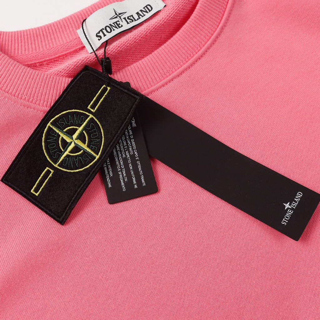 Stone Island pink sweatshirt with neck tag and black logo patch label on the collar area