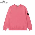 Stone Island crewneck sweatshirt in pink with ribbed cuffs and hem; black logo patch on sleeve