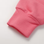 Stone Island pink sweatshirt ribbed cuff and hem close-up with textured knit fabric