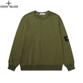 Olive green crewneck sweatshirt with long sleeves and ribbed cuffs