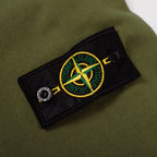 Olive green sweatshirt sleeve patch with Stone Island crest