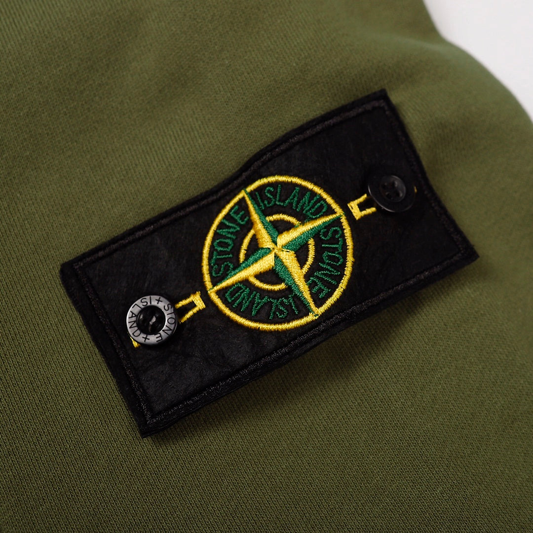 Olive green sweatshirt sleeve patch with Stone Island crest