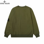 Olive green crewneck sweatshirt with ribbed hem and small side patch